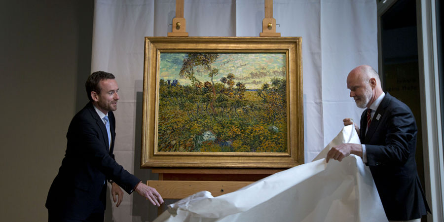 Van Gogh Museum director Axel Ruger, left, and senior researcher Louis van Tilborgh, right, unveil "Sunset at Montmajour" during a press conference at the Van Gogh Museum in Amsterdam, Netherlands, Monday Sept. 9, 2013. The museum has identified the long-lost painting which was painted by the Dutch mater in 1888, the discovery is the first full size canvas that has been found since 1928 and will be on display from Sept. 24. (AP Photo/Peter Dejong) Netherlands Van Gogh