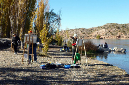 Pintores en el río