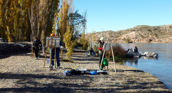 Pintores en el río